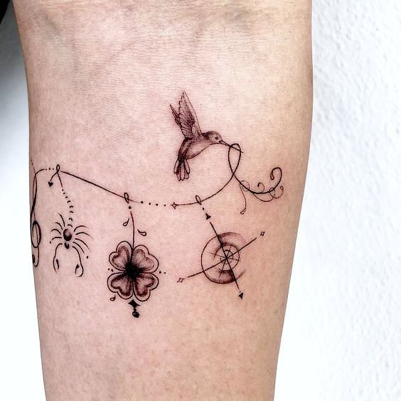 Humming bird compass tattoo.
