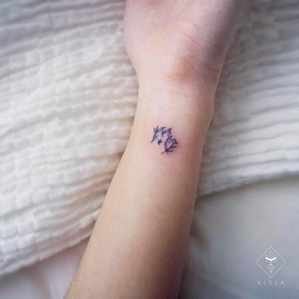 Mini Leaf Scorpio Symbol Wrist Tattoo.