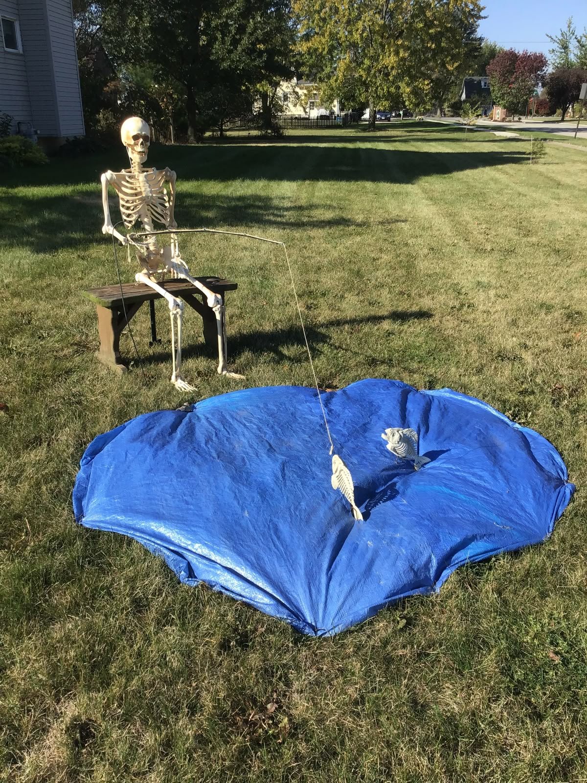 Fishing skeleton has hooked a skeleton fish.