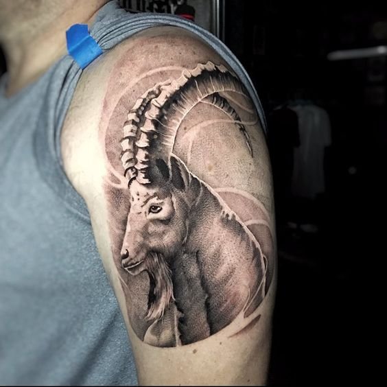 A realistic sea-goat sleeve tattoo