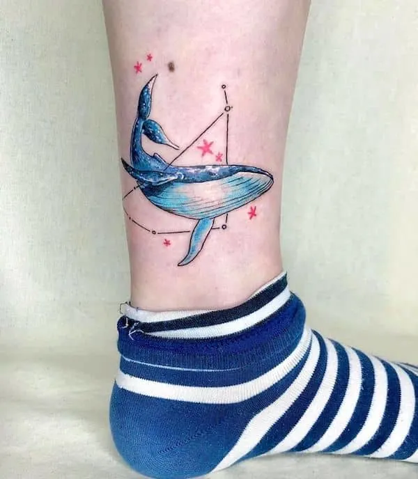 A watercolor ankle tattoo with contrasting colors