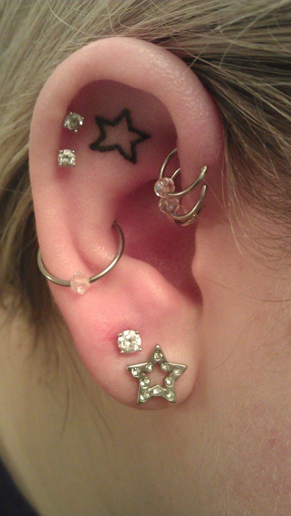 Ear Piercings with Star Tattoo