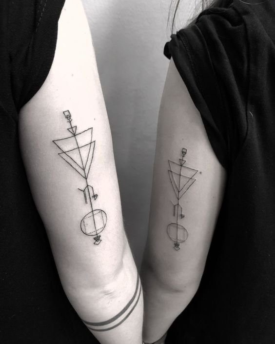 Geometric matching couple tattoos