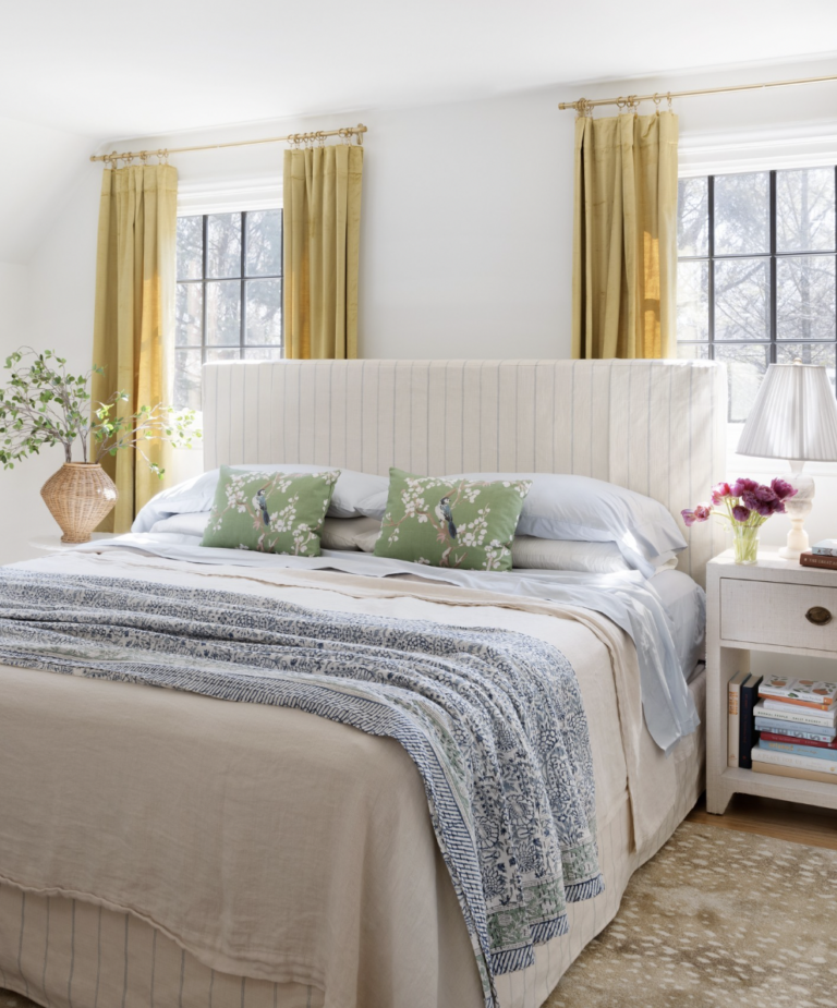 Large Windows On Both Sides Of The bed With Brown Rug