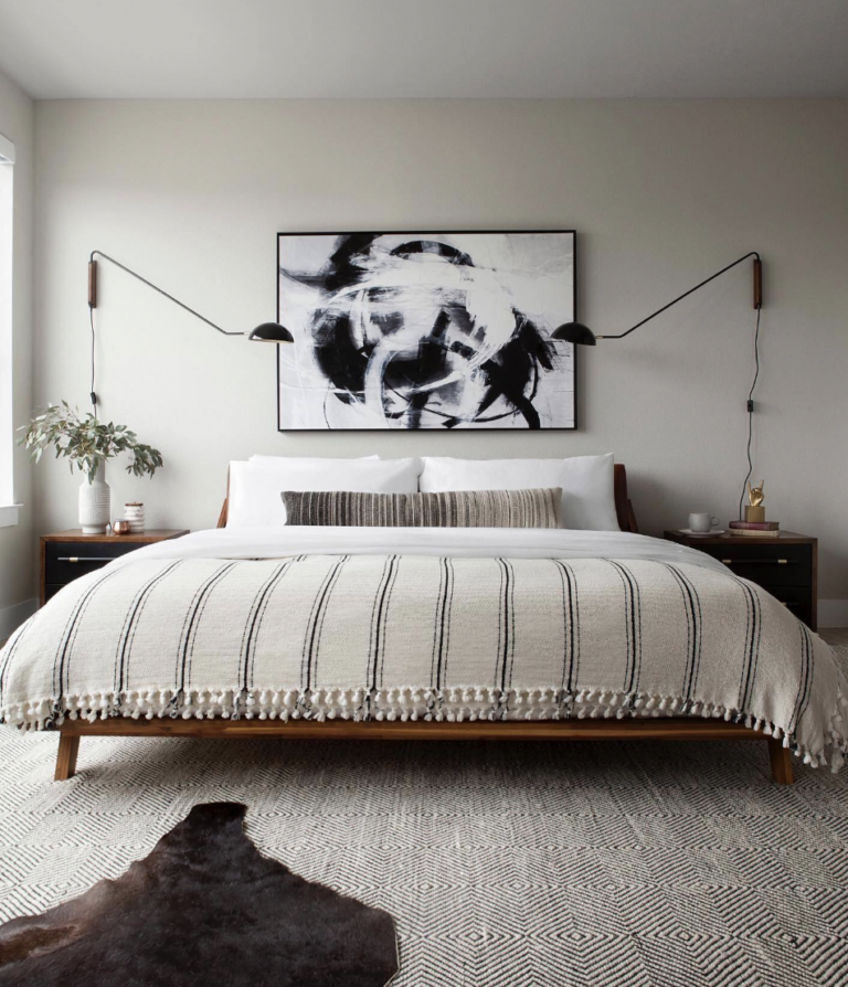 Minimalist Bedroom With White And Black Patterned Rug