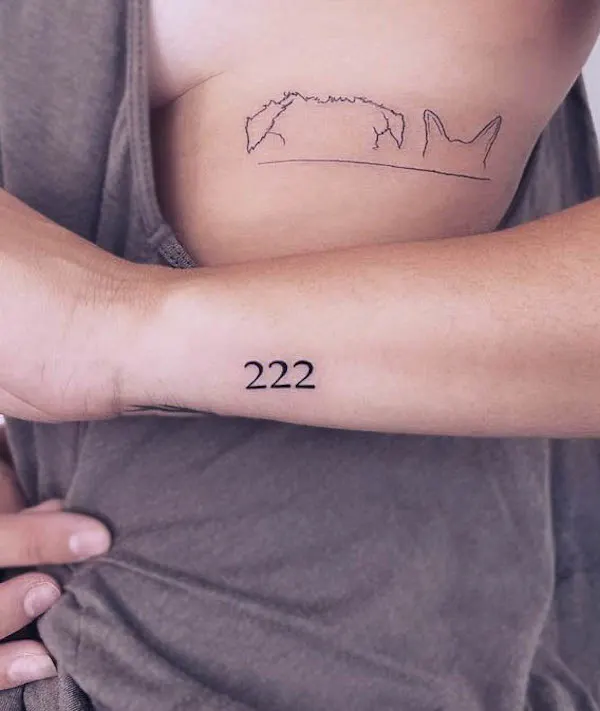 Angel number tattoo on the outer wrist