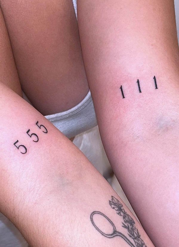 Matching angel number tattoos on the arm