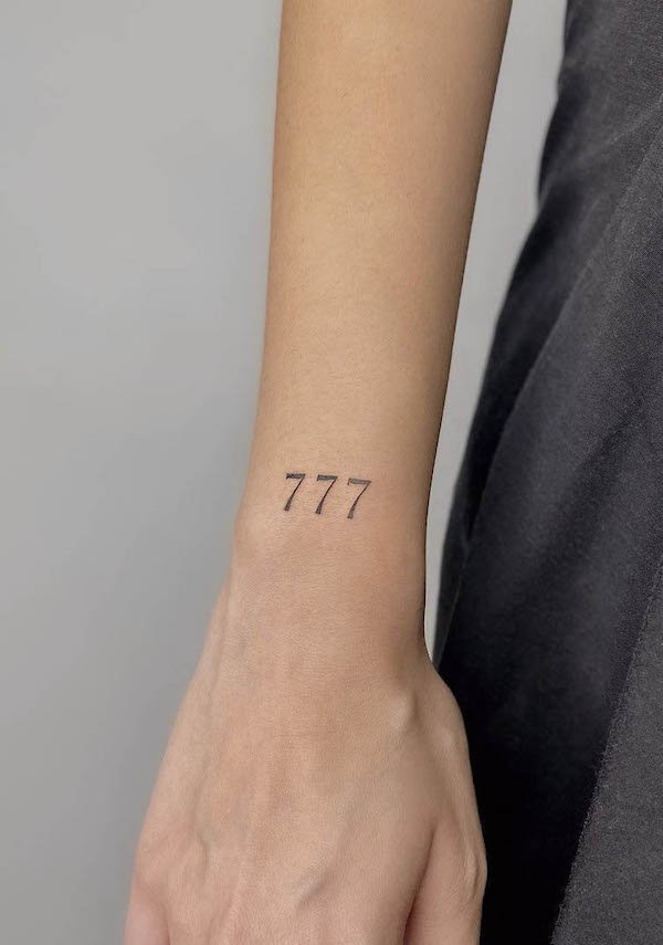 Simple 777 wrist tattoo