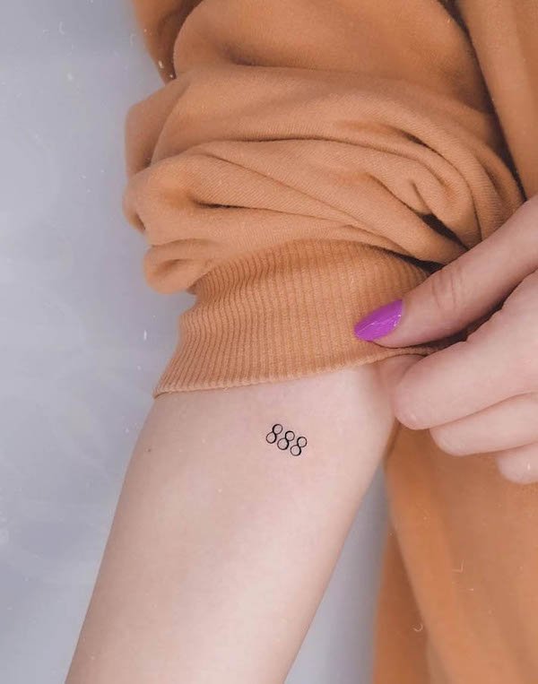 Tiny angel number on the arm