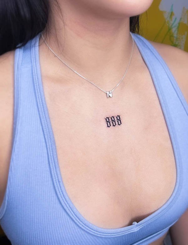 Angel number chest tattoo