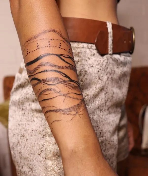 Abstract water forearm tattoo