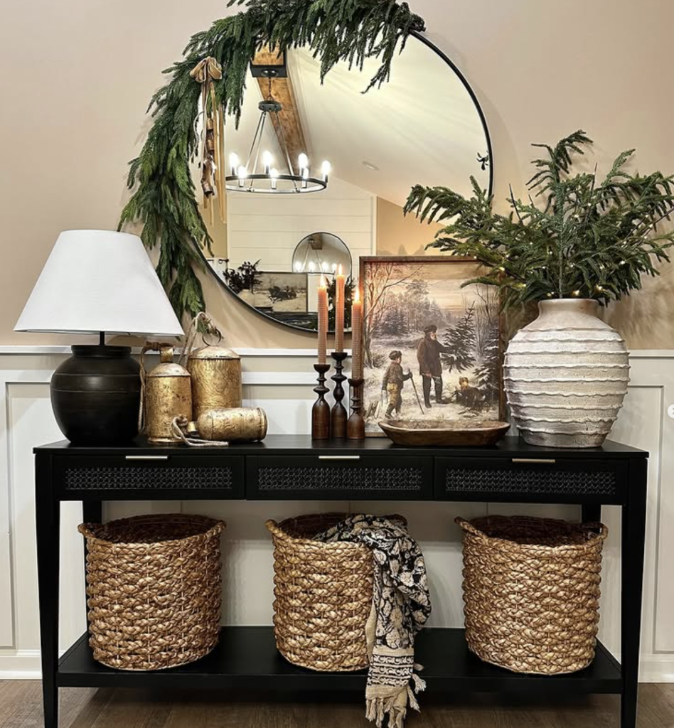 Black Console with Warm Metallic Accents and Art