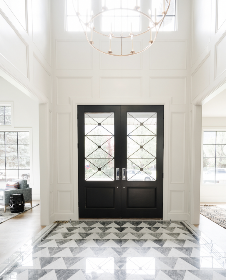 Black Door With White And Grey Flooring