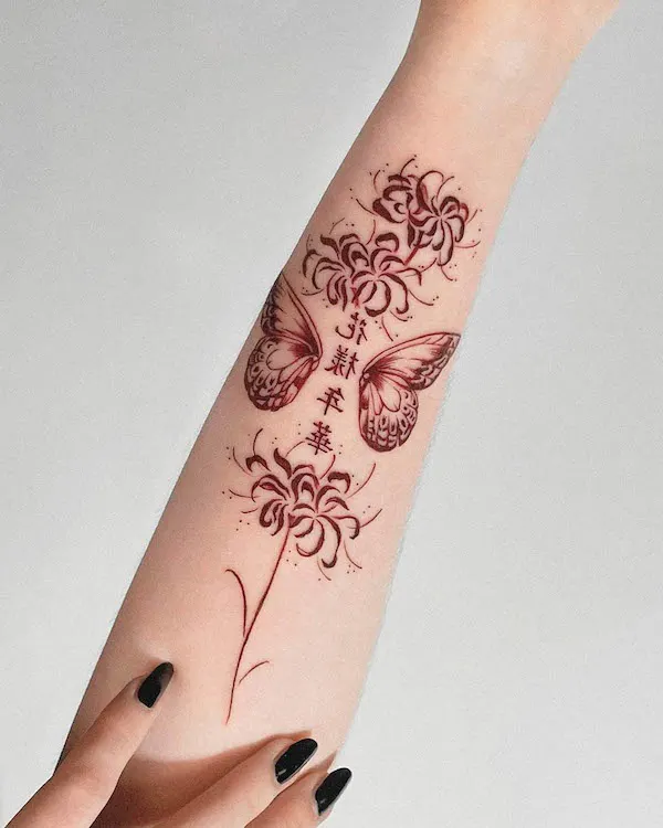 Butterfly and flowers forearm tattoo