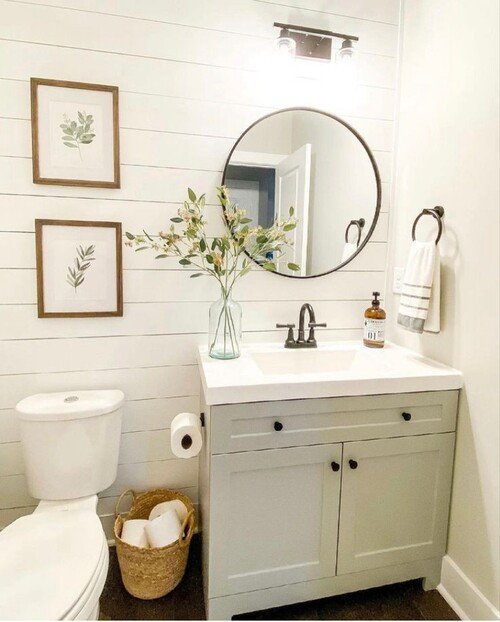 Shiplap walls and framed botanical prints