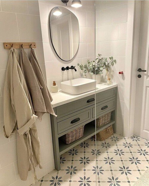 Sage green vanity with open storage