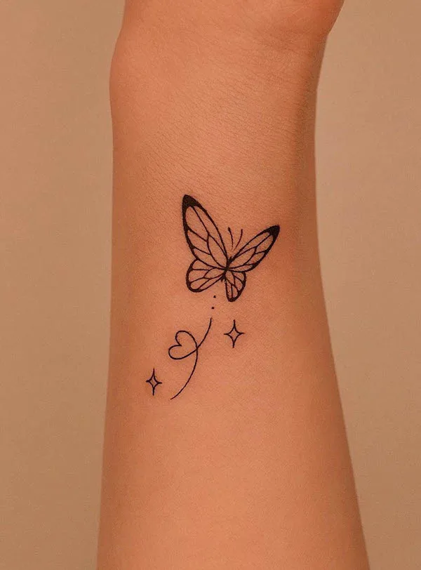Cute little butterfly forearm tattoo