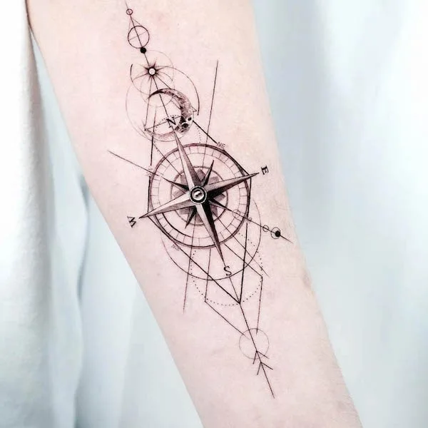 Fine line compass forearm tattoo