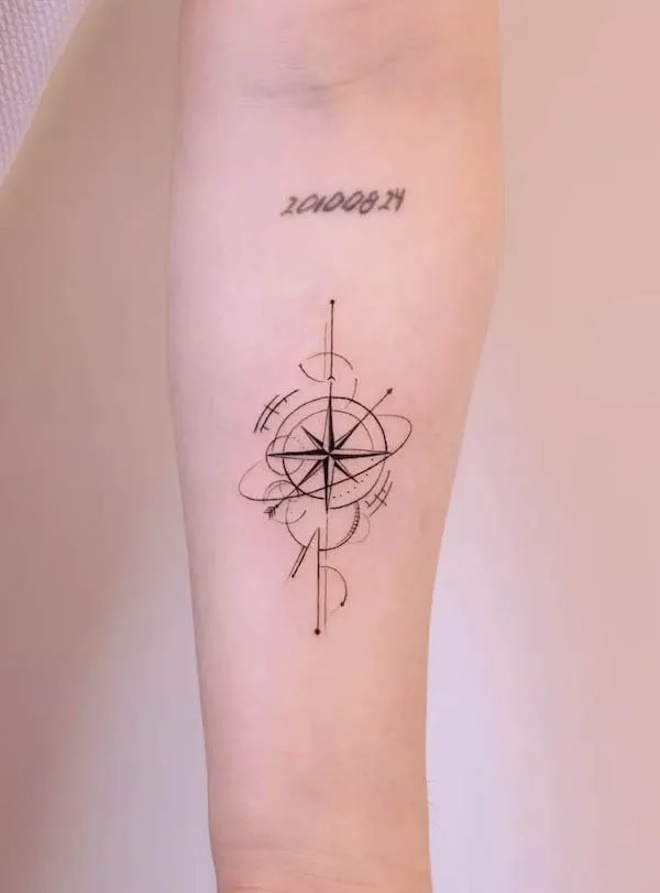 Forearm compass tattoo