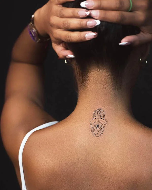 Hamsa tattoo on the back of the neck