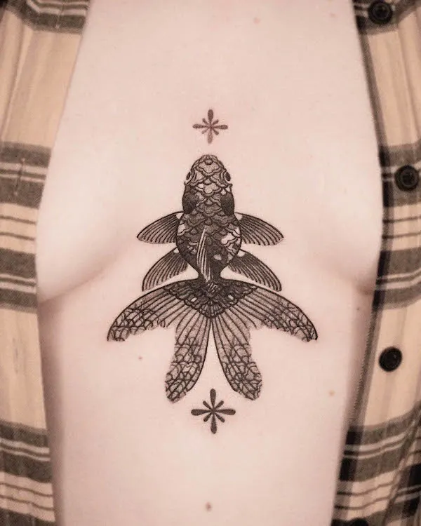 Intricate fish chest tattoo
