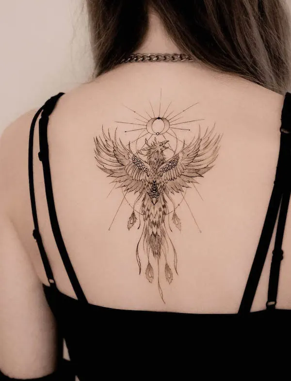 Meaningful phoenix back tattoo