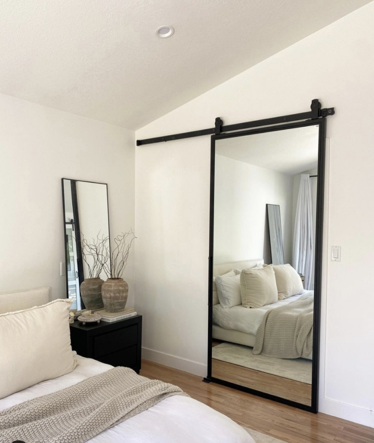 Sliding Barn Door Style Mirror In Bedroom