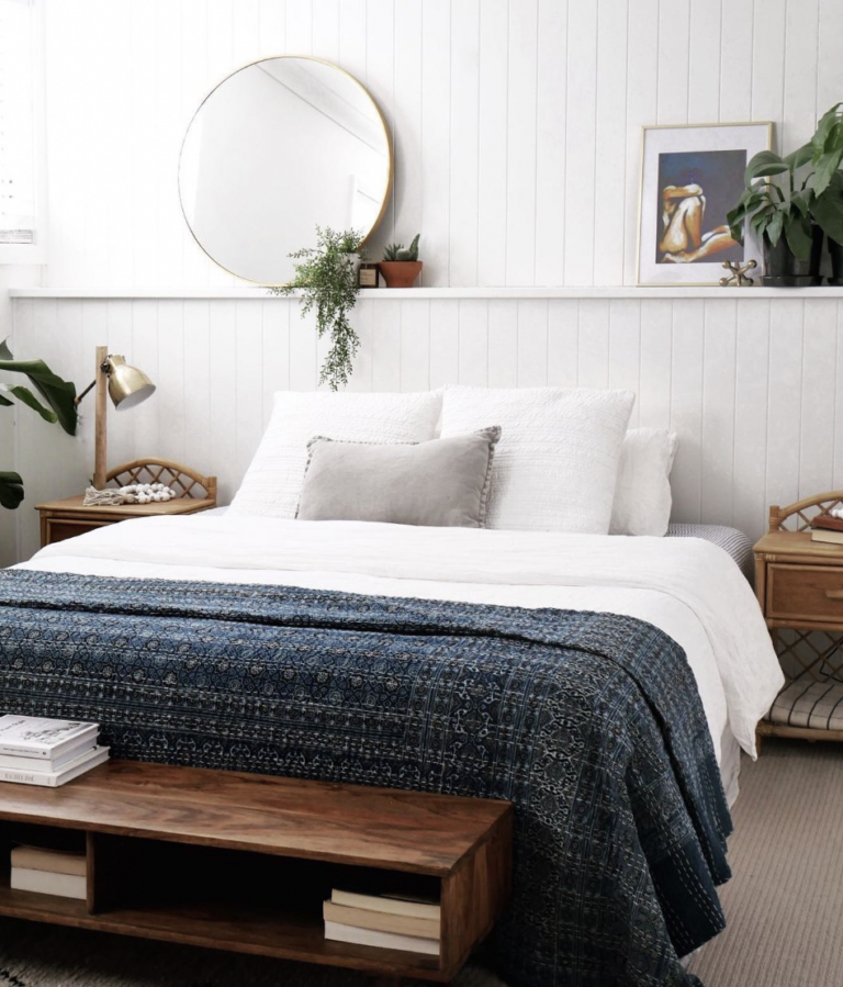 Small Mirror On A White Shiplap Wall