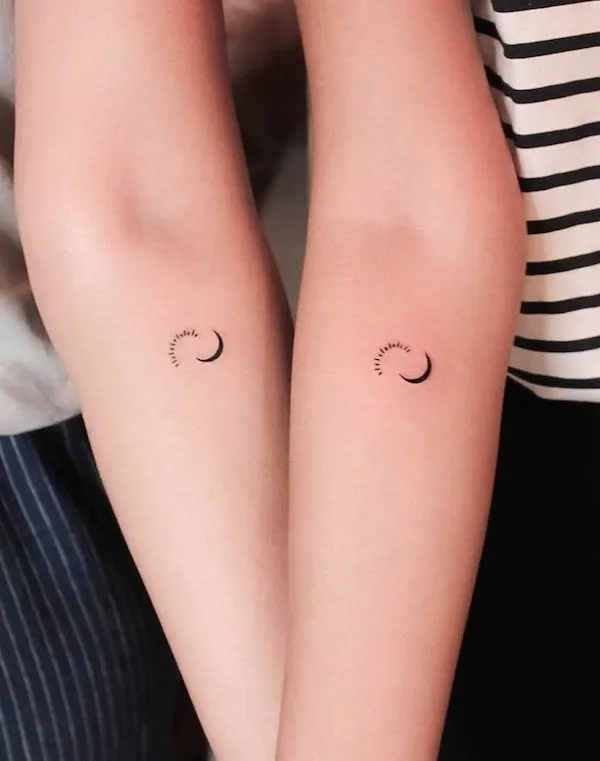 Minimalist sun and moon forearm tattoos