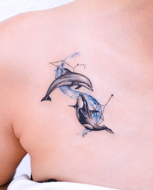 Whale and dolphin zodiac chest tattoo