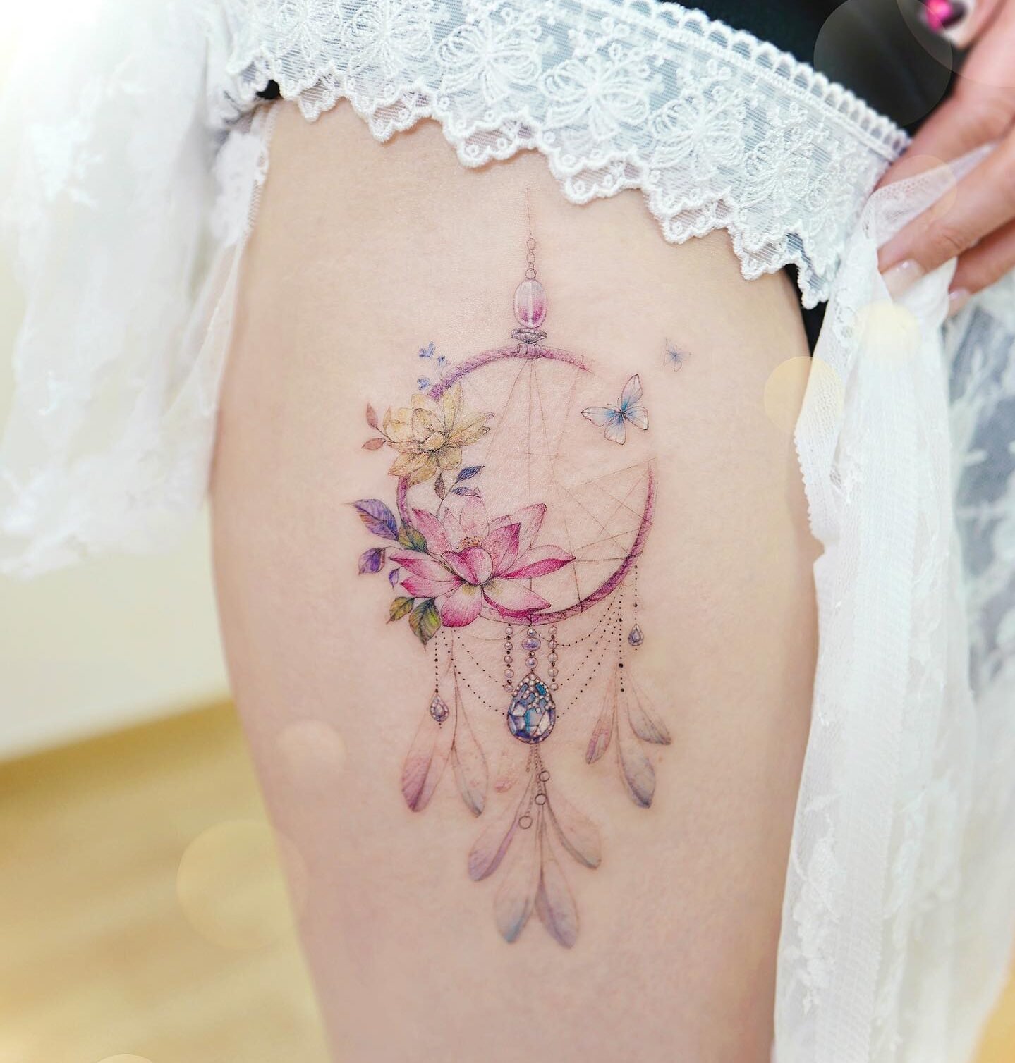 ornamental thigh tattoo