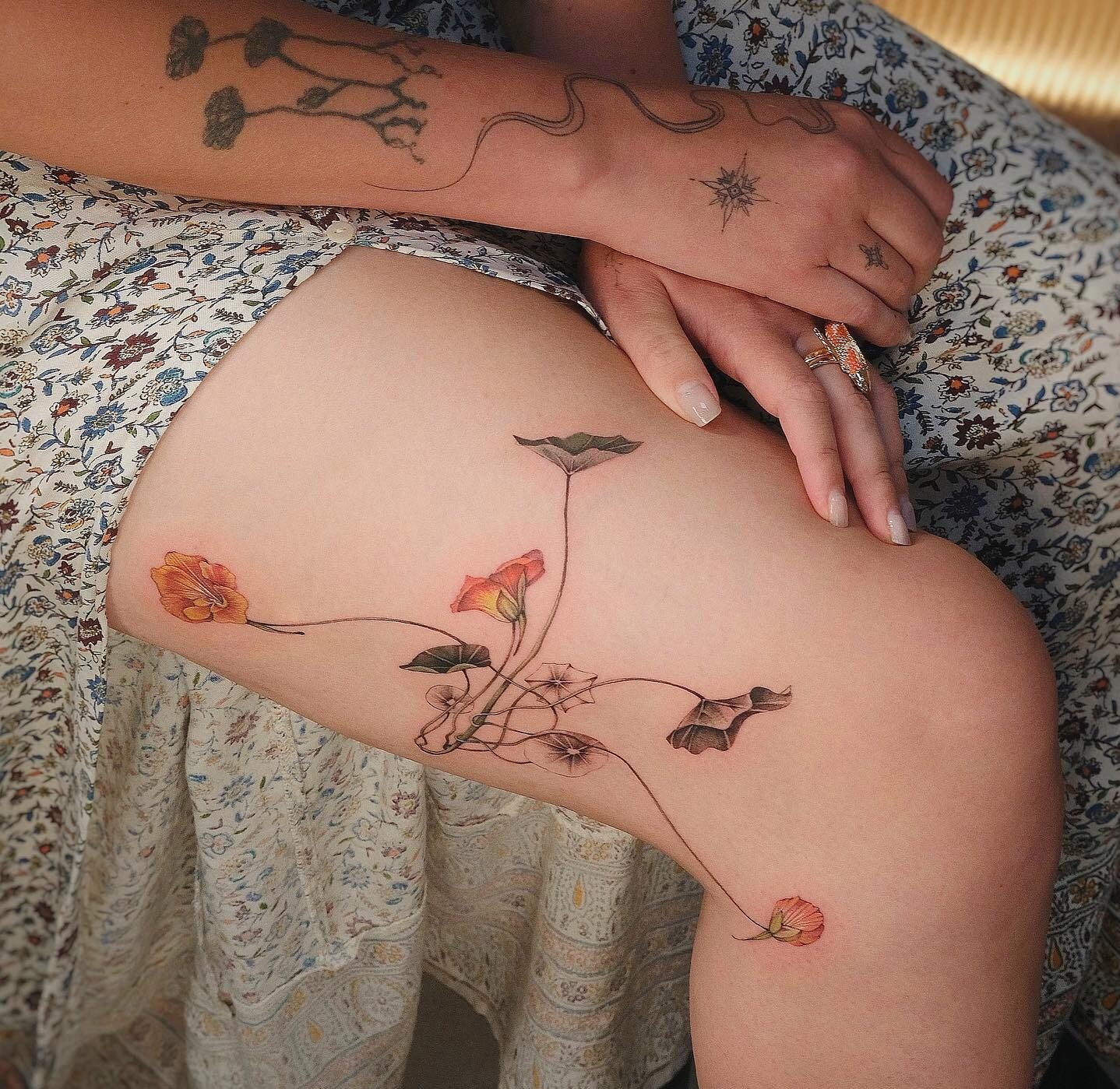 Dainty Flowers Thigh Tattoos