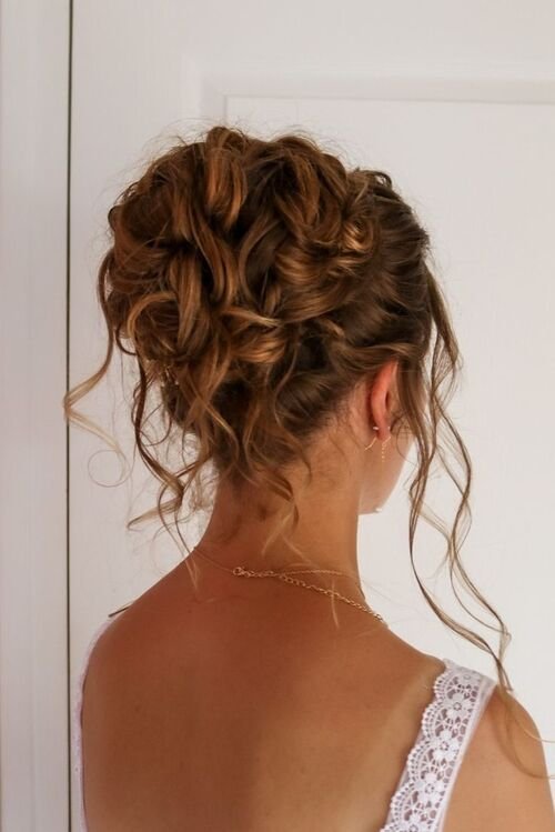 Curly Bun with Fly Aways