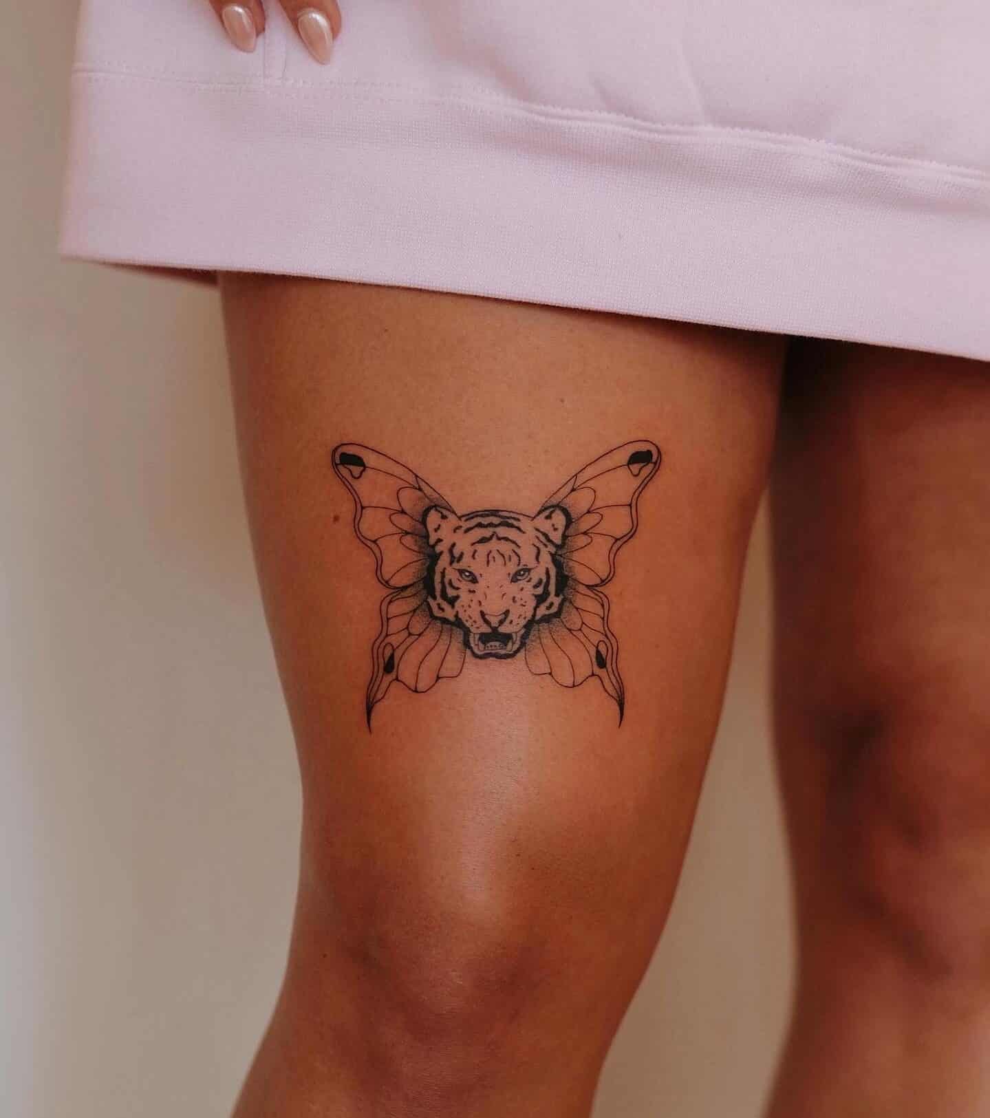 This fine line tiger butterfly tattoo