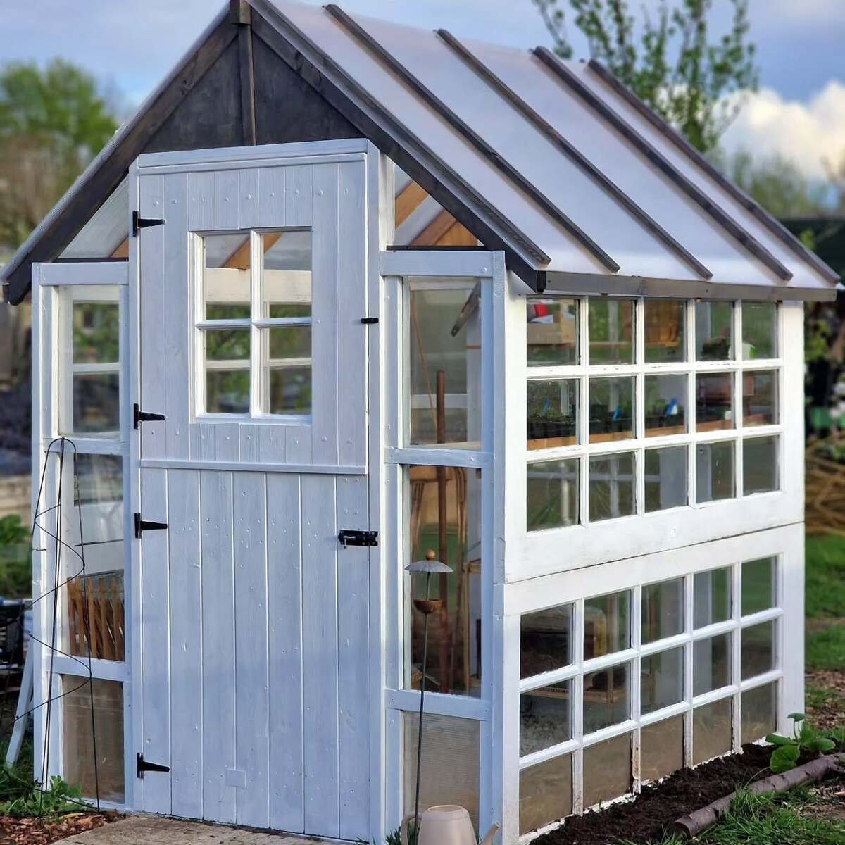 Greenhouse From Reclaimed Wood And Metal Roofing