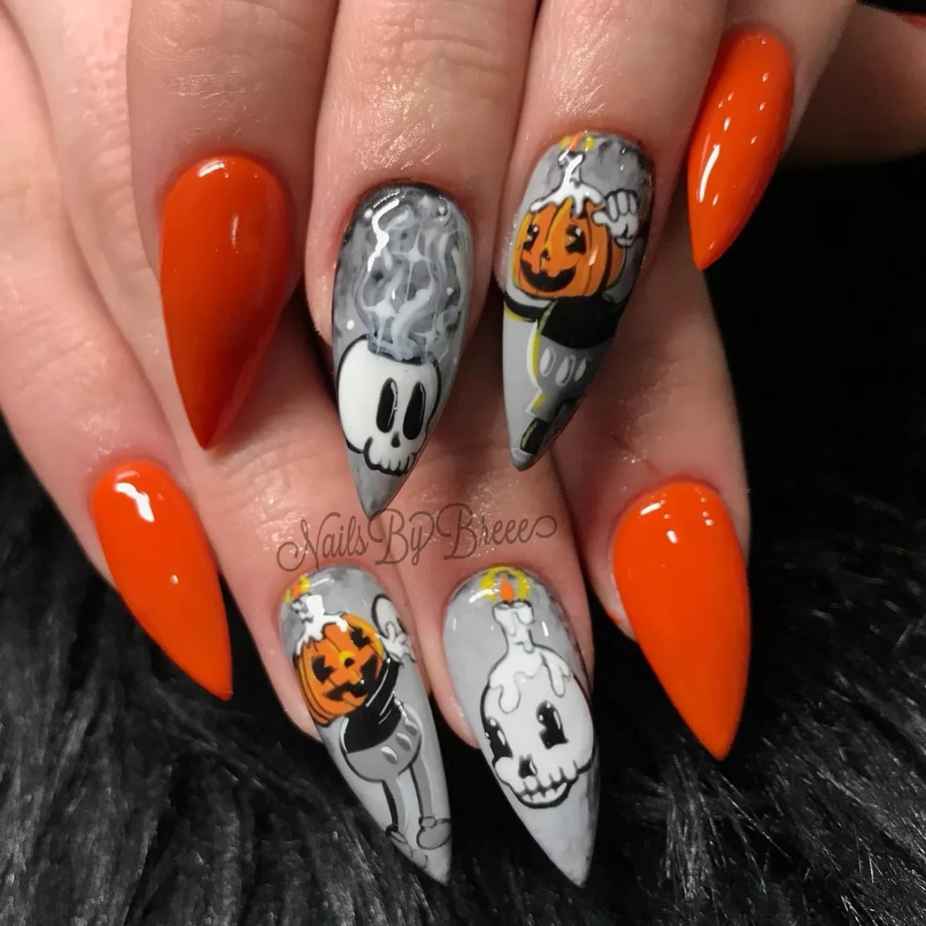 Pointy Orange Nails with Disney Skull Art