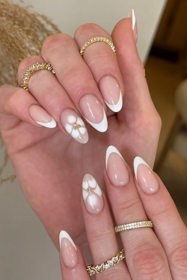 Elegant French Tip Nails with Floral Accents