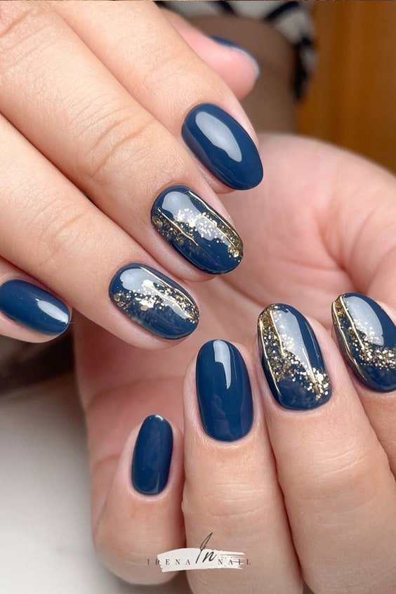 Indigo Blue Almond Nails with Gold Glitters
