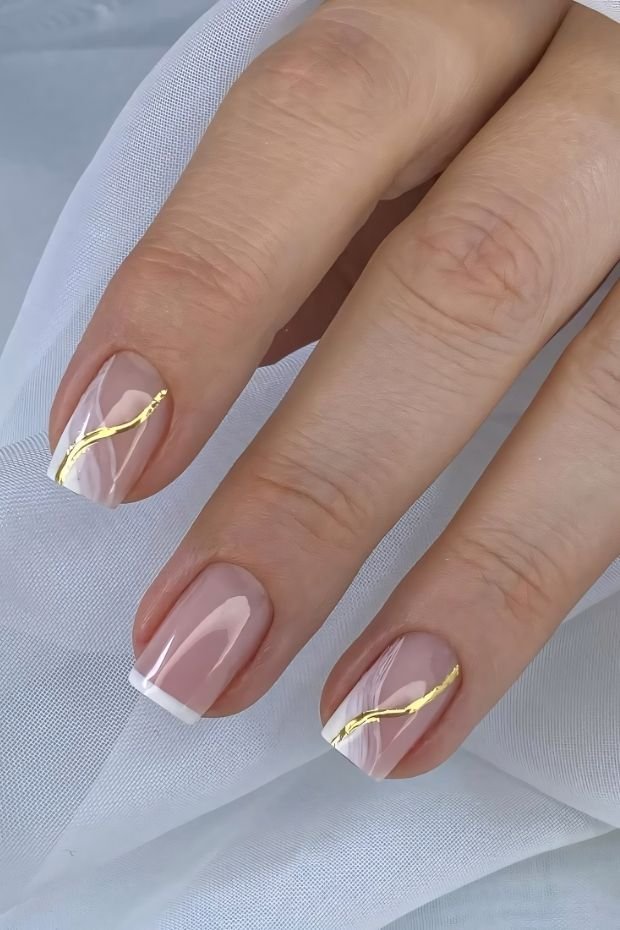Luxurious French Tip Nails with Golden Accents