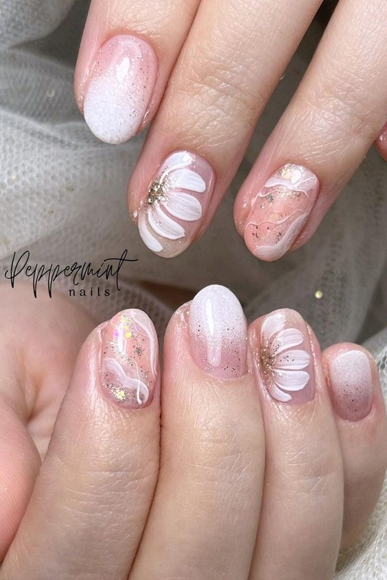 Soft Pink Almond Nails with Cute Floral Design
