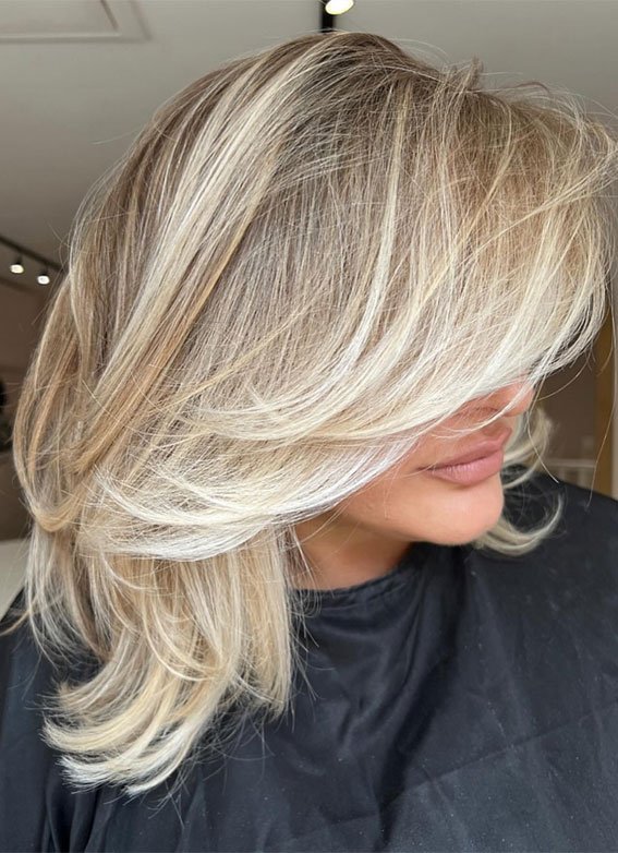 Dimensional Layered Ash Blonde Hair with Feathered Finish