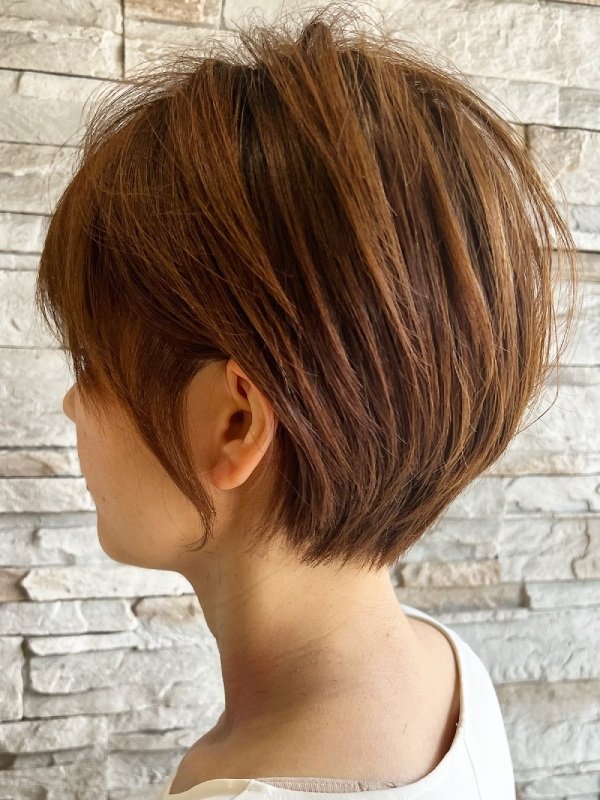 Layered Short Brown Pixie with Warm Caramel Highlights