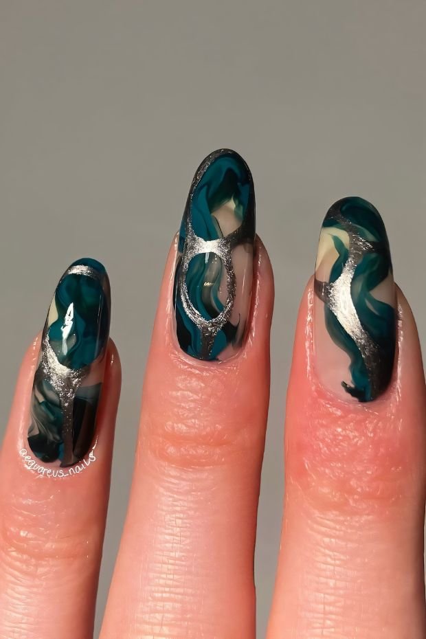 Nail Art with Abstract Swirls and Silver Accents