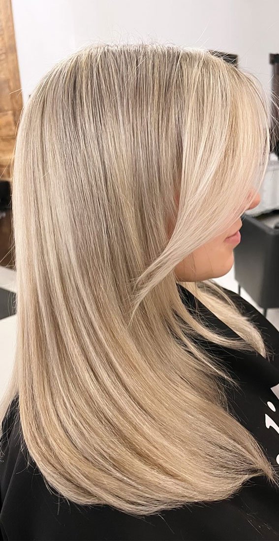 Pearl Champagne Blonde Straight Hair with Layers and Curtain Bangs