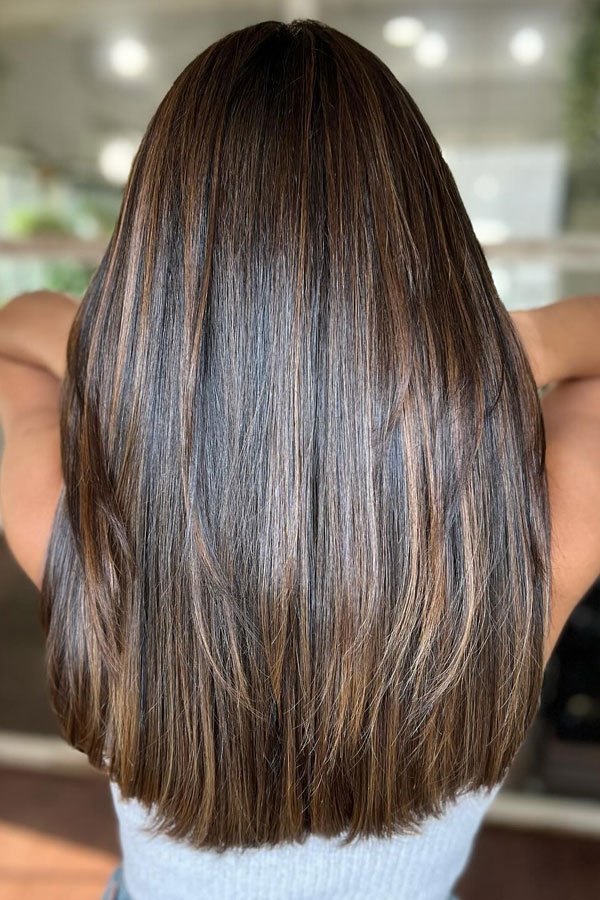 Sleek Brunette Layered Haircut with Subtle Highlights