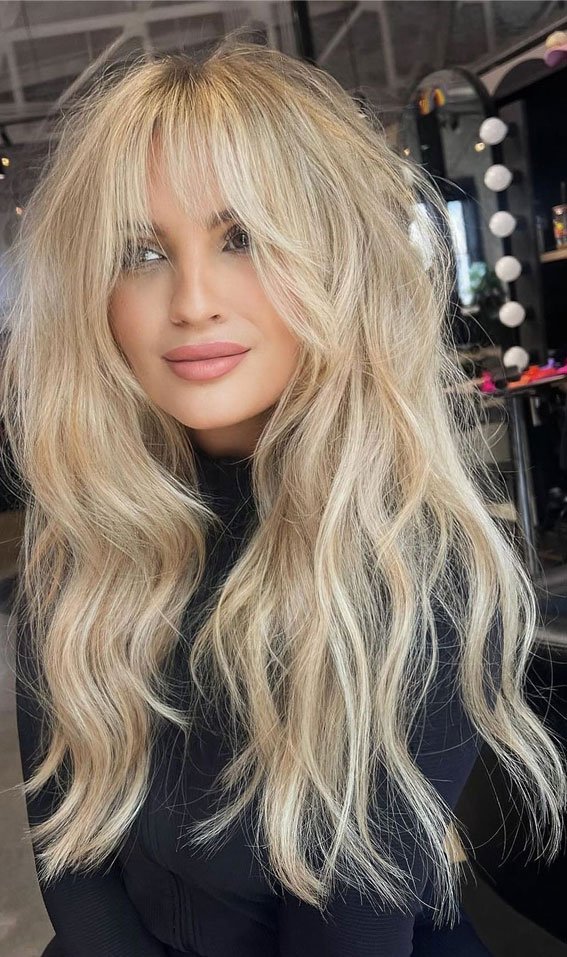 Tousled Shaggy Sandy Blonde Hair with Curtain Bangs